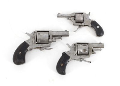 three old revolvers on a white background with a white background
