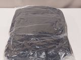 a plastic bag on a table with a cell phone in it