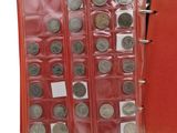 a red book with a bunch of coins inside of it