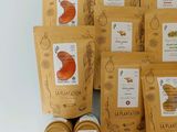 many bags of food that are sitting on a table