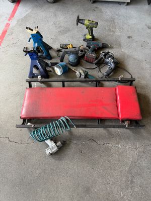 a red bench with tools on it in a garage