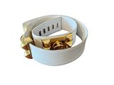 a white leather belt with gold studs on it