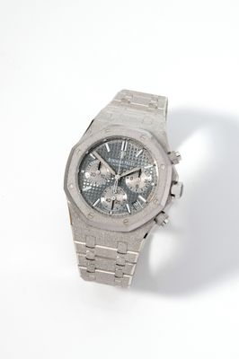 an image of a close up of a watch on a white surface