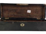 a black suitcase with a key in it on a white background
