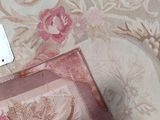 a piece of fabric on the floor next to a sewing machine