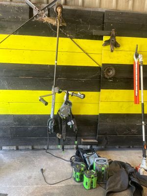 yellow and black striped wall with tools and tools on it