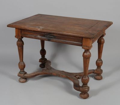 an old wooden table with a drawer underneath it on a gray surface