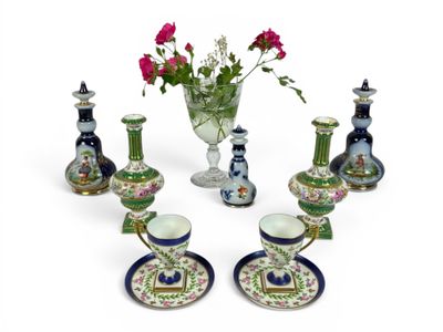 a lot of different vases and cups on the table