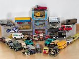 a lot of toy trucks that are sitting on the floor