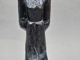 an image of a statue of a man with a hat on his head