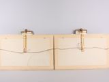 two pieces of wood with wires attached to them on top of a table