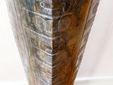 a vase that is sitting on a wooden table
