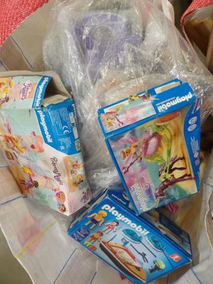 a lot of toys in a plastic bag on a table