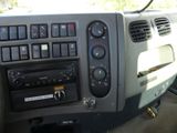 a dashboard of a car with a radio in it