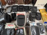 a lot of bags and other items on the table