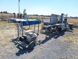 two machines that are parked on the side of the road