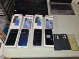a lot of different cell phones sitting on a table