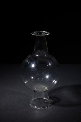 a glass vase that is sitting on a table