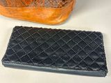 two purses that are sitting next to each other