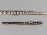 a flute and a flute case on a table