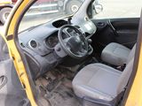 a small yellow car with a steering wheel and a dashboard