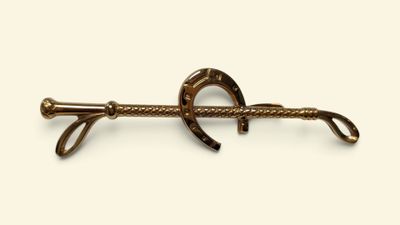 a close up of a horse shoe hook on a white background