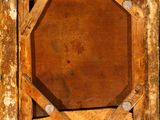 a picture of an old wooden frame with a cross on it