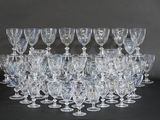 a lot of wine glasses that are sitting on a table