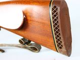 a close up of a rifle on a white background