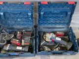 two blue tool boxes with tools in them on the floor