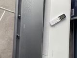 two laptops that are sitting next to each other on the floor