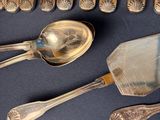 a lot of silver spoons and spoon spoons on a table