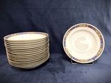 two plates and a bowl are stacked on a stand