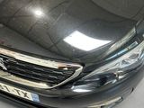a picture of a black car parked in a showroom