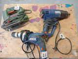 several tools that are sitting on a piece of wood