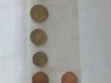 a lot of coins in a plastic bag on the table