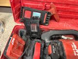 a red tool box with tools in it on the floor