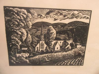 a black and white picture of a village with a church