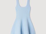 a little girl in a light blue dress
