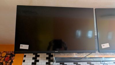 two monitors sitting on top of a computer desk