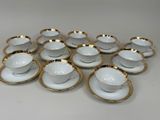 six white and gold cups and saucers with gold rims