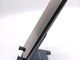 a close up of a cell phone on a stand