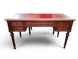 an old wooden desk with a red top on a white background