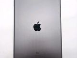 an apple ipad is shown on a white surface with a black apple logo