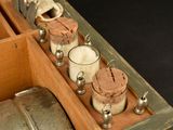 a wooden box filled with different types of glassware