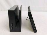 two remotes that are sitting next to each other on a table