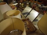 a table with two lamps and a mirror on it