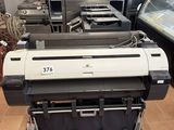 a large printer that is sitting in a room