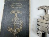 a book and a pair of scissors sitting on a table