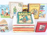 several children ' s books are stacked on top of each other